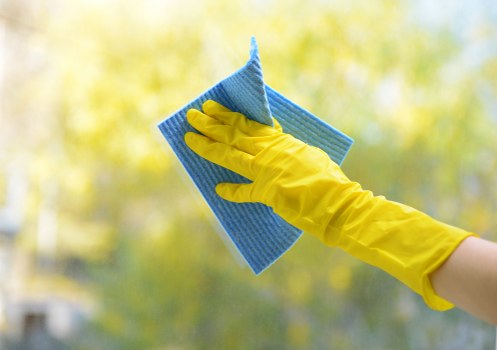 Professional home cleaners in W2 maintaining a spotless living room