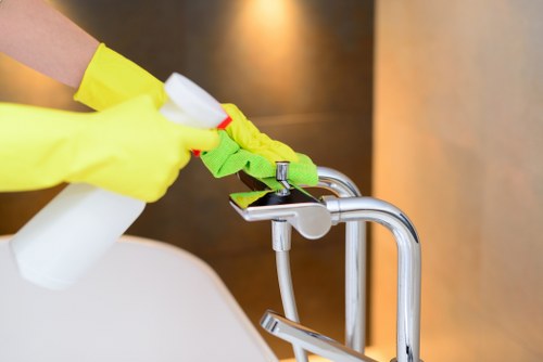 Professional cleaner supporting a scheduled workplace cleaning team