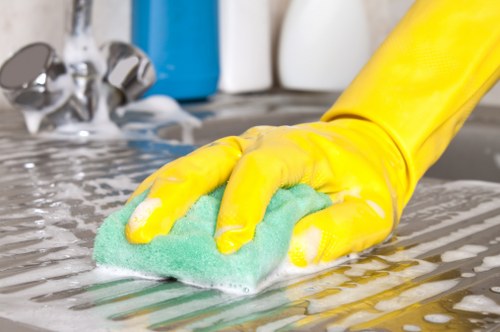 Cleaner refreshing an armchair during upholstery cleaning in W2